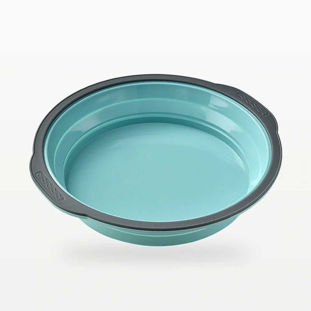 Gray foldable six-cavity silicone muffin mold with dark frame and collapsible cups shown empty on white background