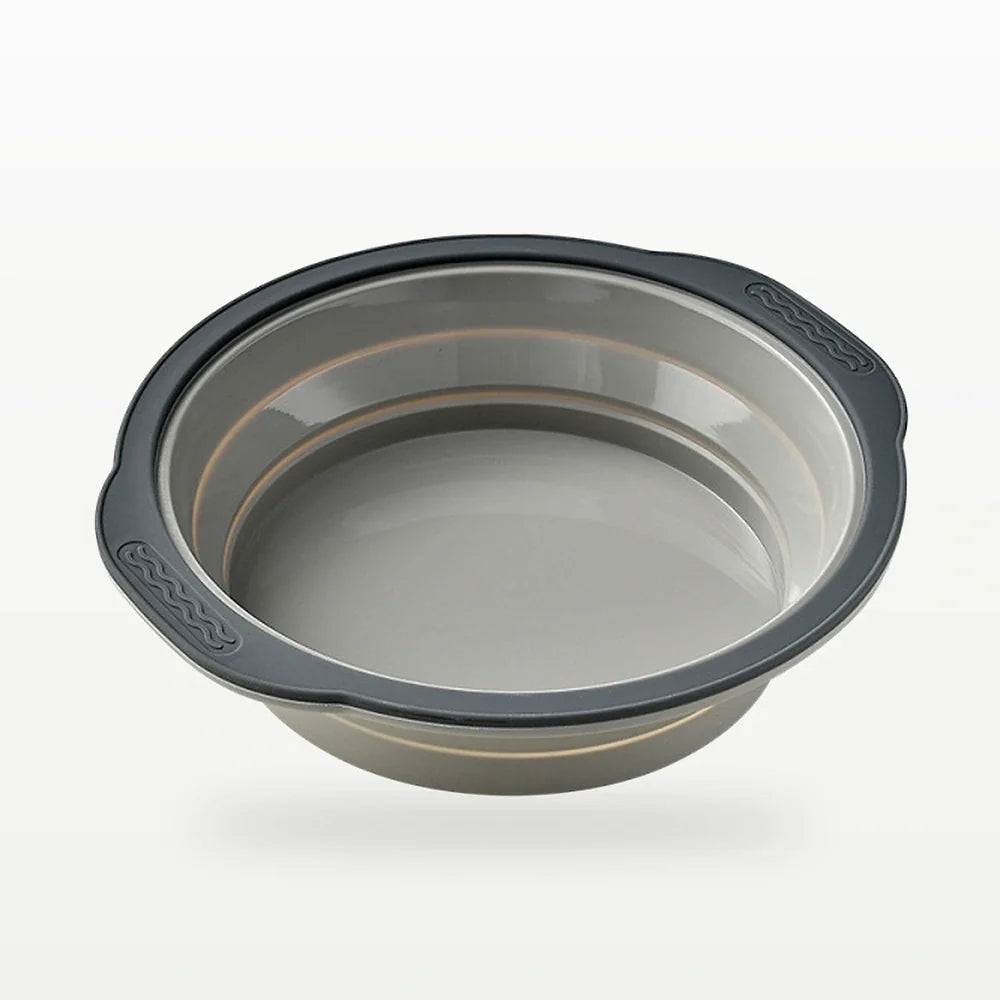 Gray foldable twelve-cavity silicone muffin mold with dark frame and collapsible cups shown empty on white background